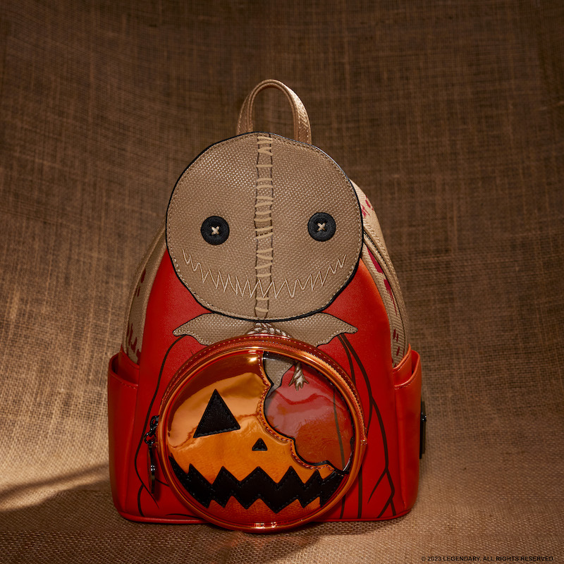 Image of our NYCC 2023 exclusive Trick 'r Treat Sam Cosplay Mini Backpack featuring an appliqué of Sam and a circular front pocket shaped like a half eaten pumpkin lollipop 